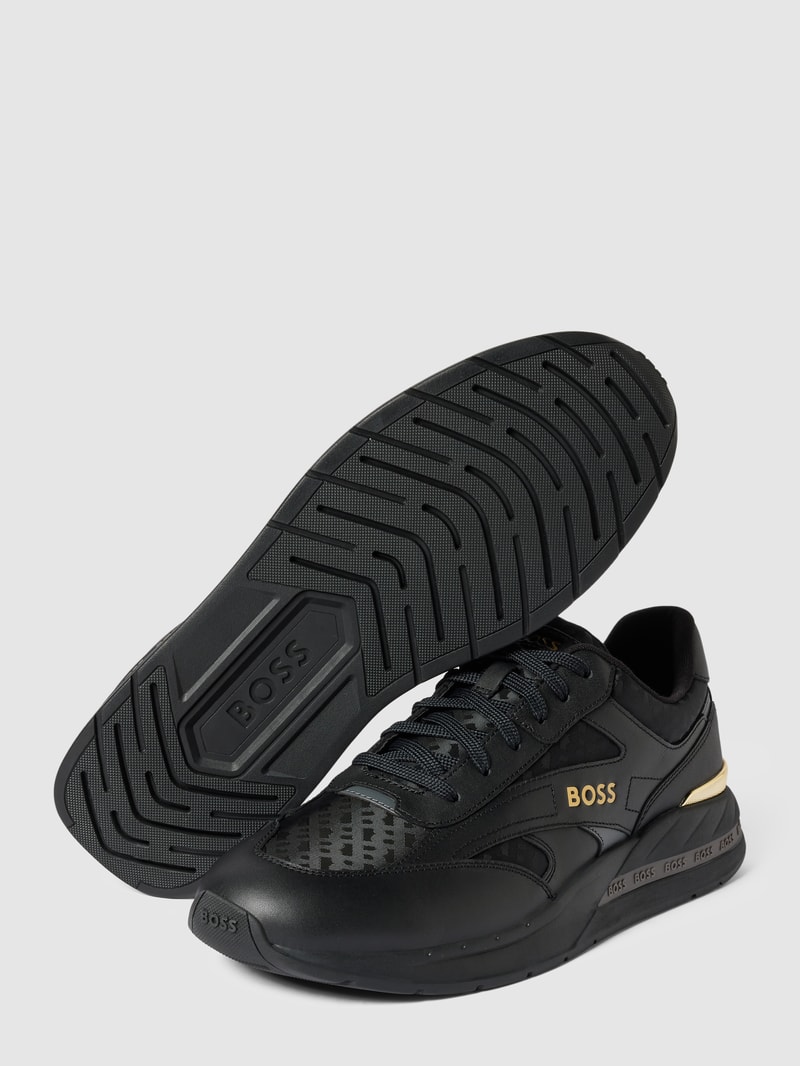 Sneaker aus Leder-Mix in schwarz