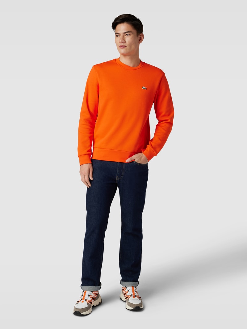 Sweatshirt in unifarbenem Design mit Label-Stitching in orange