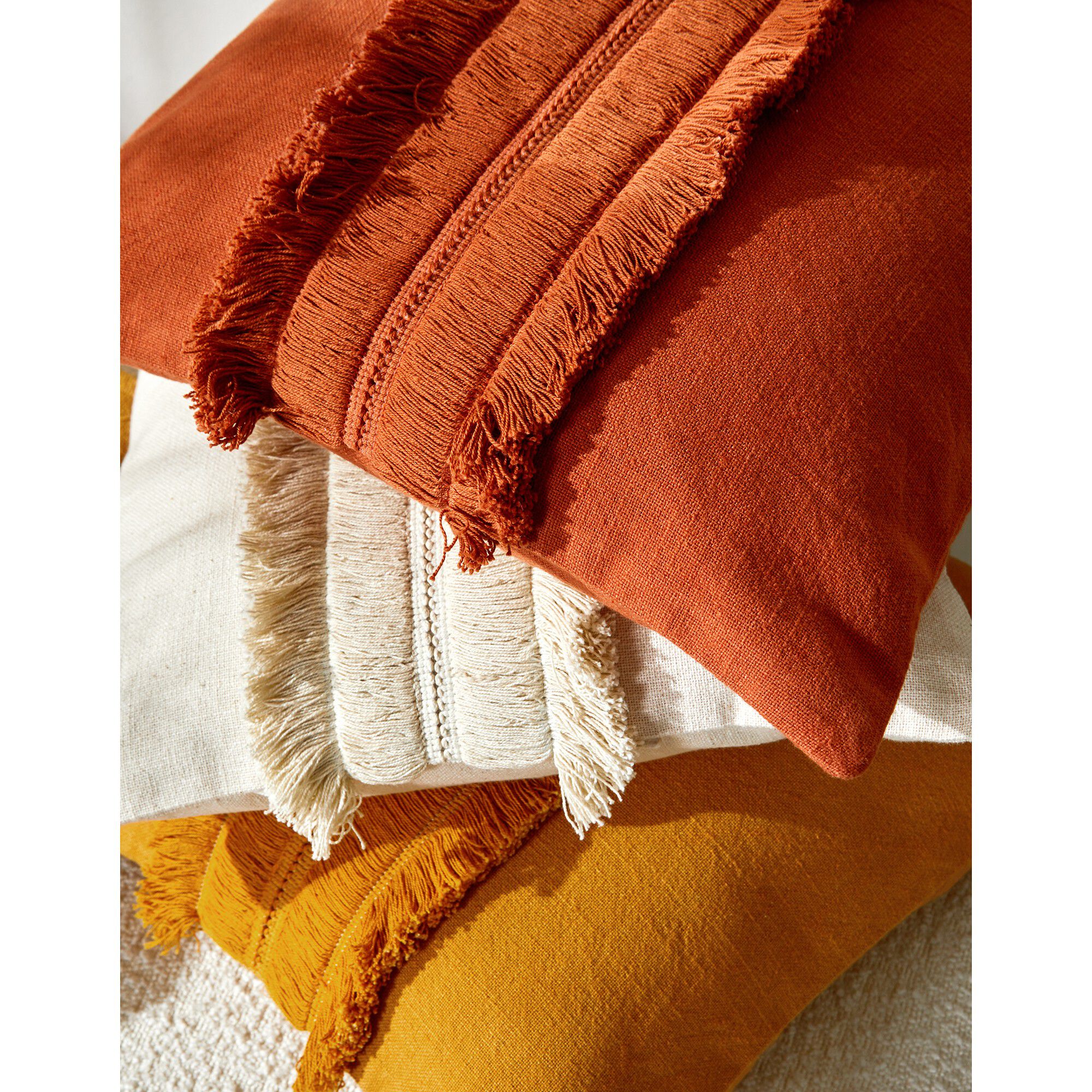 Coussin avec galon franges