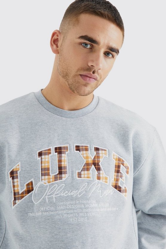 Kastiges Oversize Sweatshirt mit luxuriöser Applikation