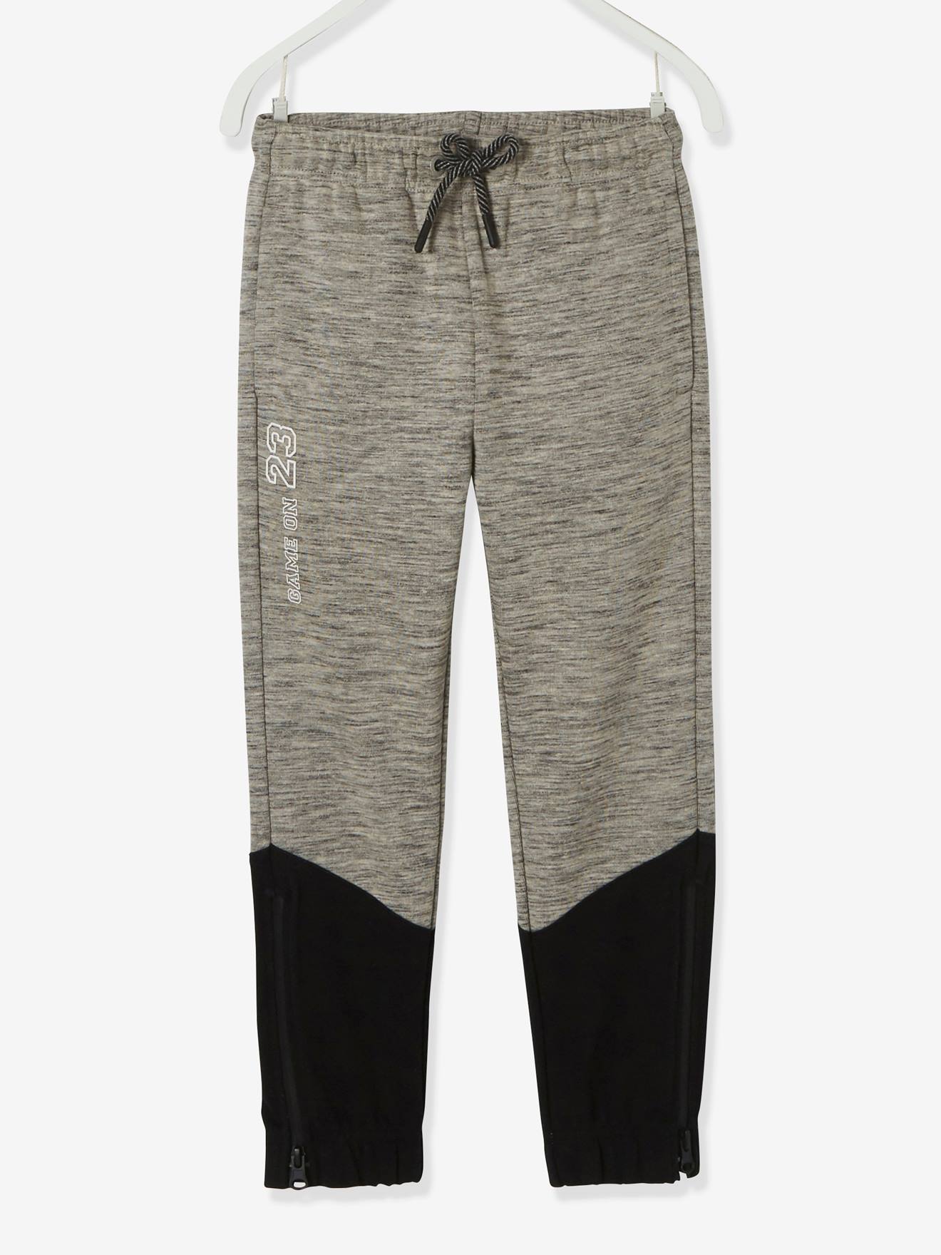 Pantalon de sport garçon en matière technique détails fluo noir