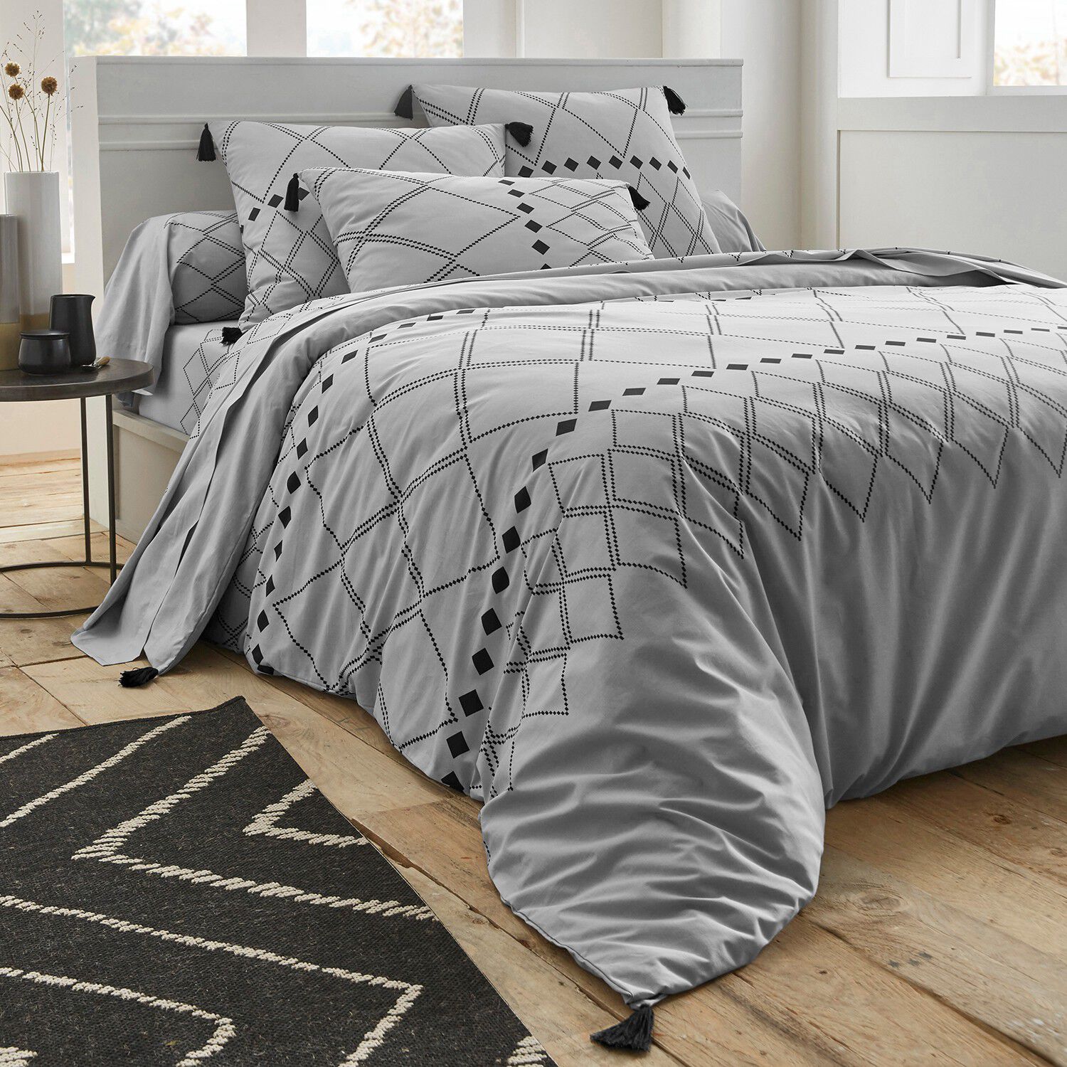 Linge de lit Massaï coton à motifs graphiques et finitions pompons
