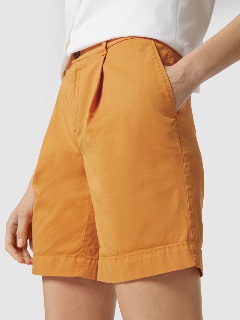 Bermudas mit französischen Eingrifftaschen in orange