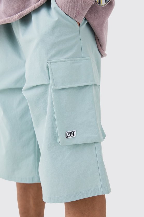 Lockere elastische Stretch-Shorts mit Logo