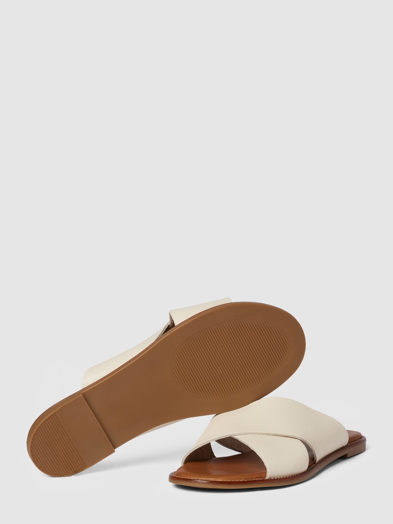 Pantoletten aus Leder mit gekreuzten Riemen in offwhite