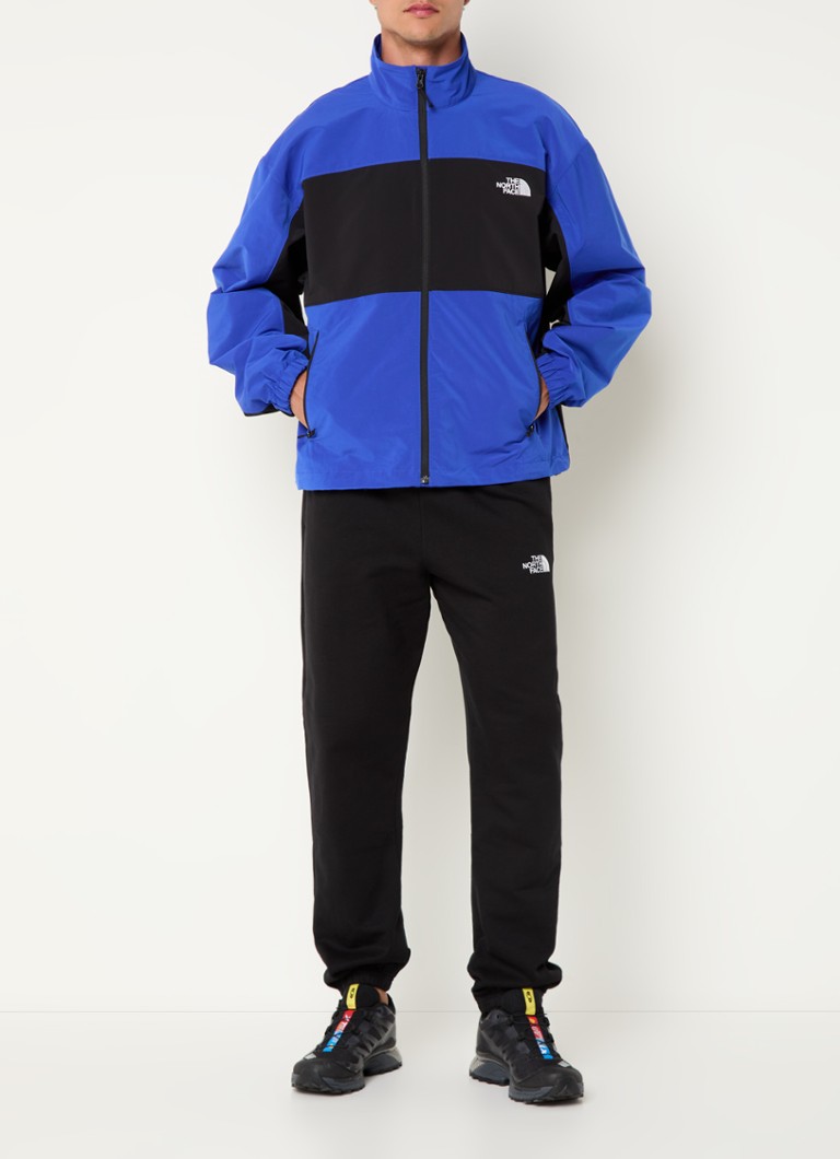 Jaqueta corta-vento The North Face com logotipo e bolsos com zíper.