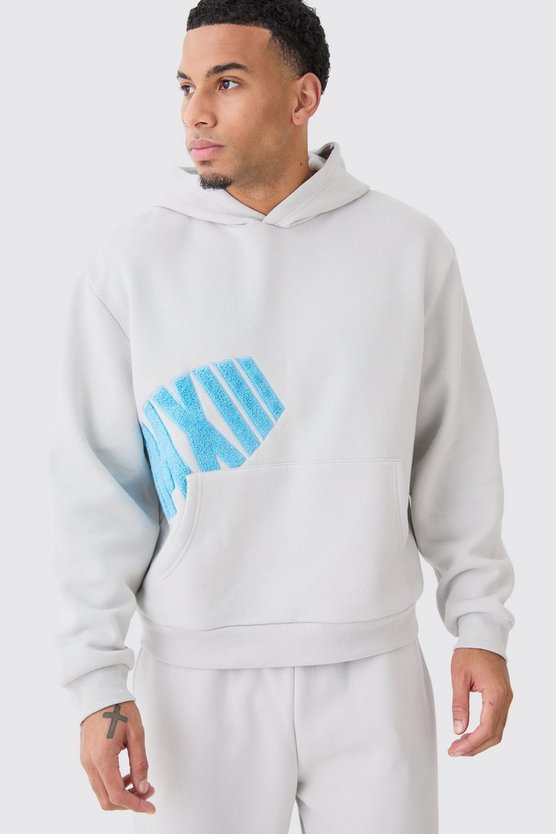 Kastiger Oversize Hoodie mit Borg-Applikation