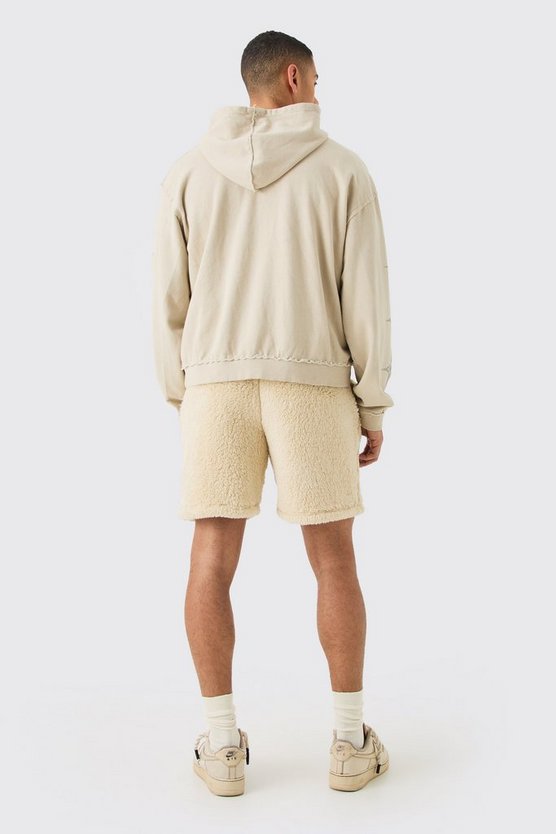 Lockere mittellange Shorts mit Borg-Stickerei