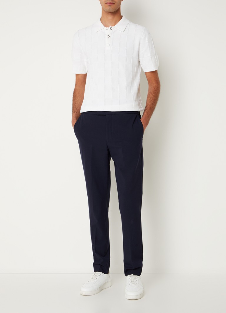 Pantaloni Reiss Found cu croială mulată, talie cu șnur și buzunare cusute.