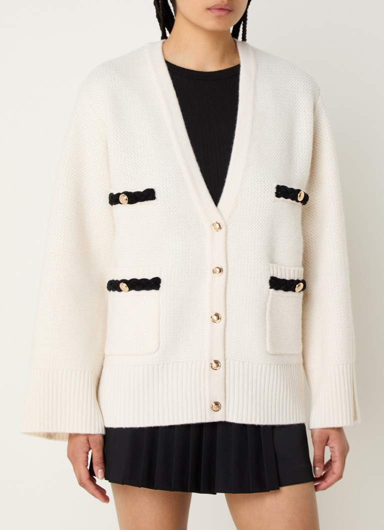 Cardigan gros din lână de la Sandro, cu buzunare aplicate.