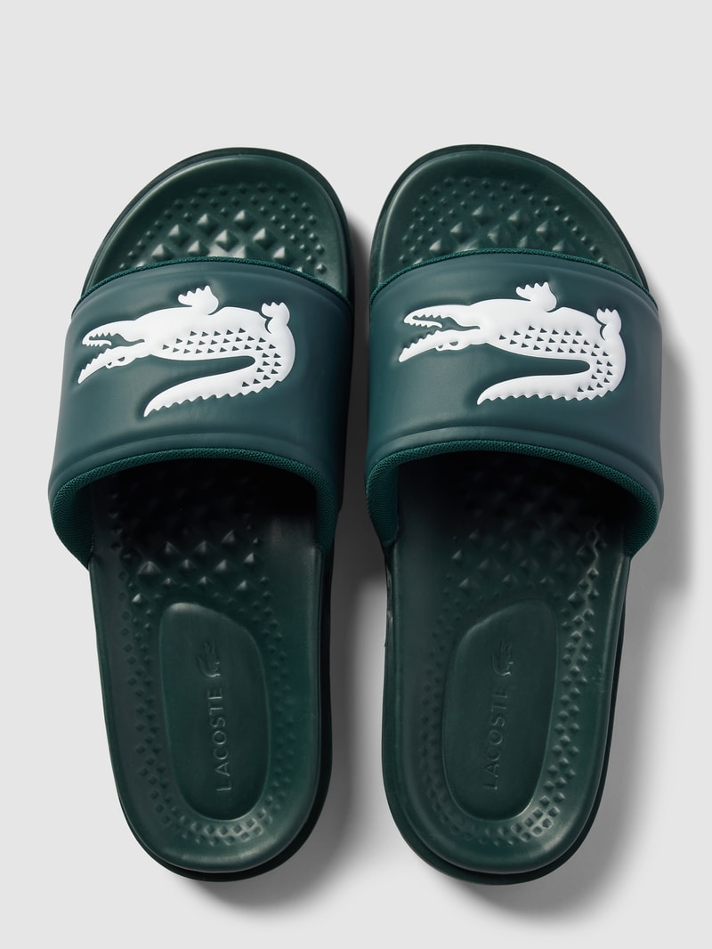 Slides mit Label-Applikation Modell 'Croco Dualiste' in dunkelgrün
