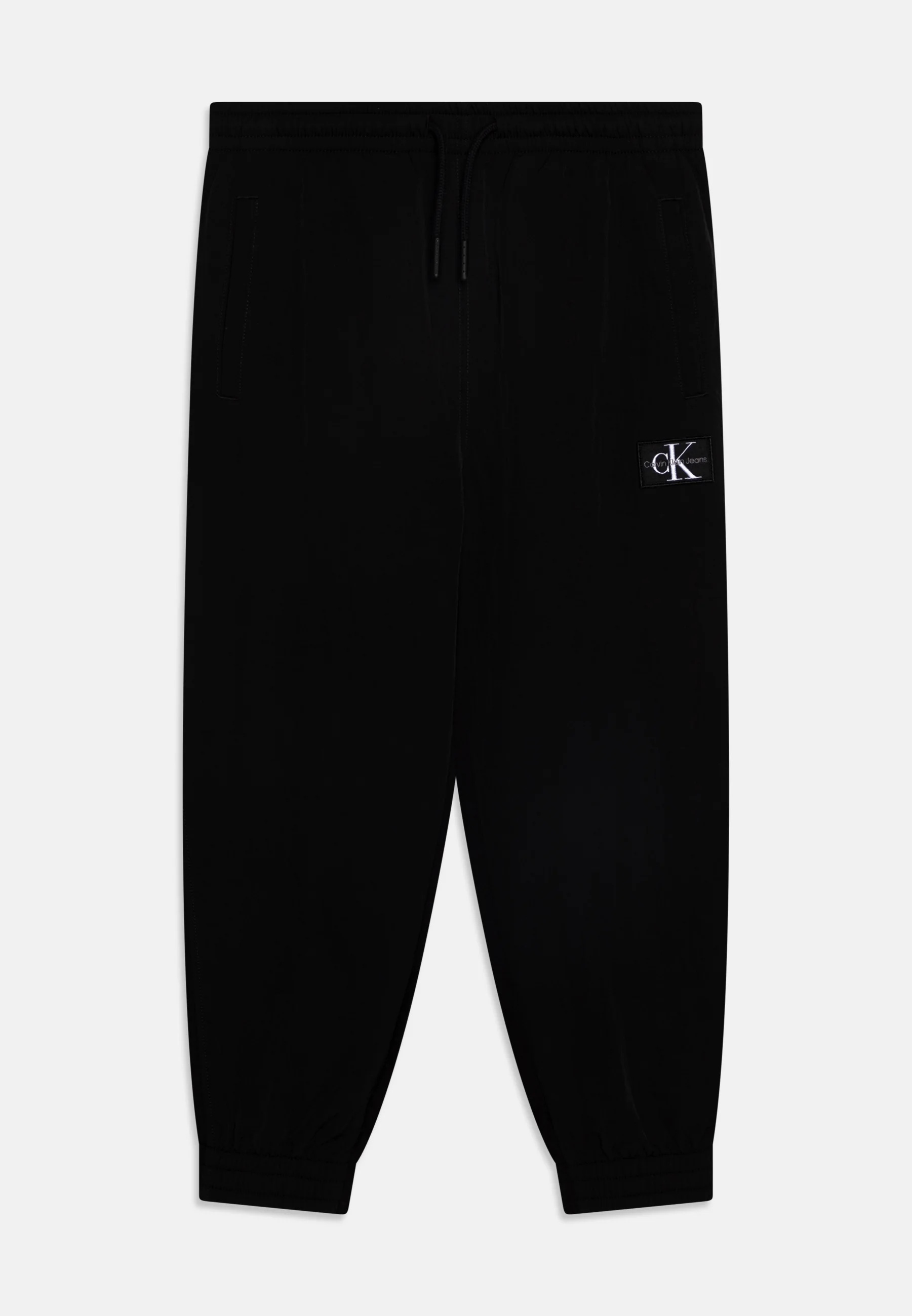 Pantalones deportivos Calvin Klein Jeans MIX MEDIA MONOCROMÁTICOS