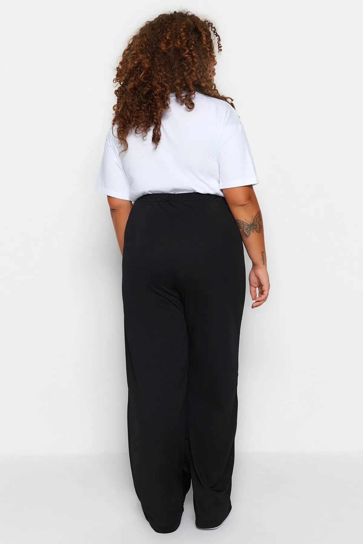 Trendyol Curve  Schwarze gerippte Strickhose aus Krepp mit hoher Taille TBBSS23AR00021