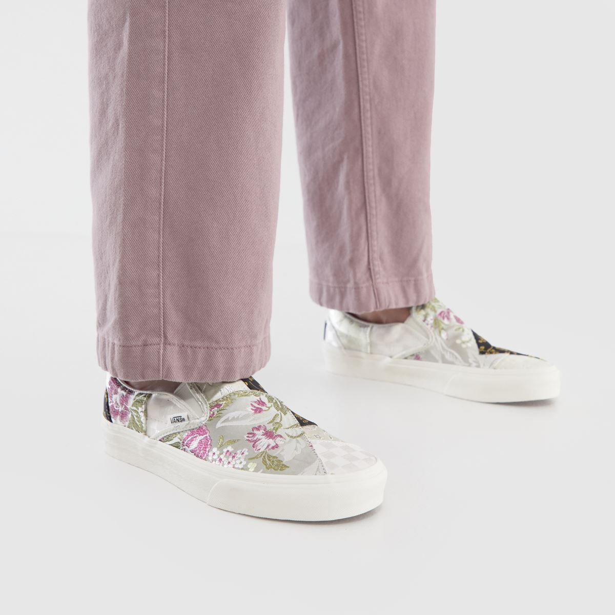 Vans – Slip-on-sneakers med lappmönster i grått och svart