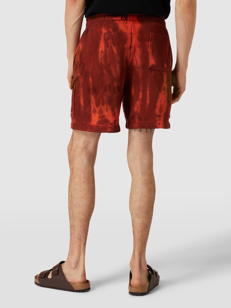 Sweatshorts mit Batik-Look in dunkel orange