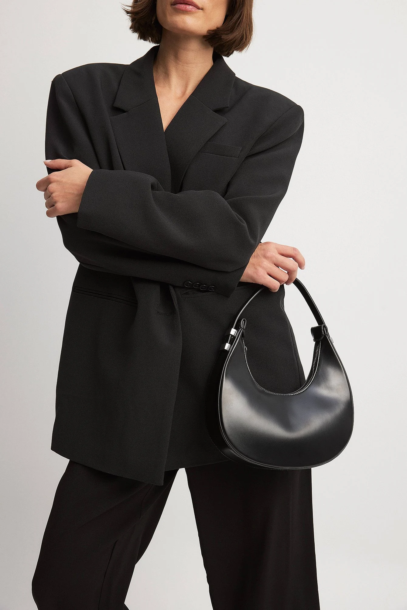 Glänzende abgerundete Tasche