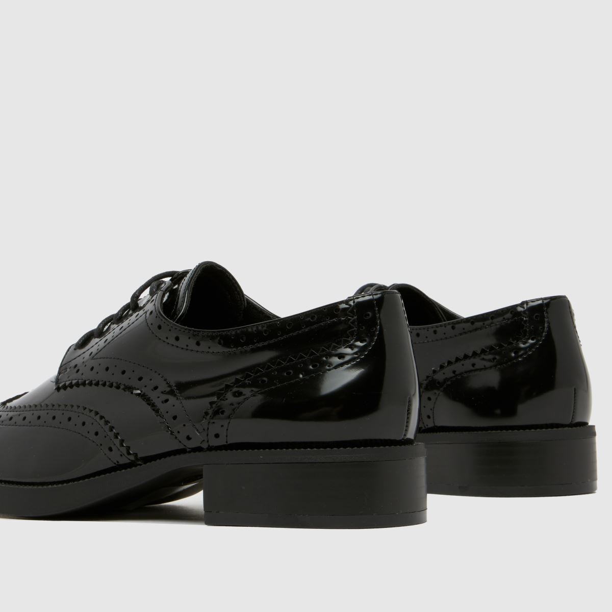 Schuh Lallie brogue lapos talpú cipők fekete színben