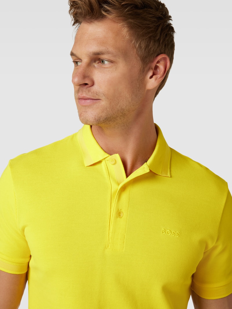 Poloshirt mit Label-Stitching Modell 'PADDY' in gelb