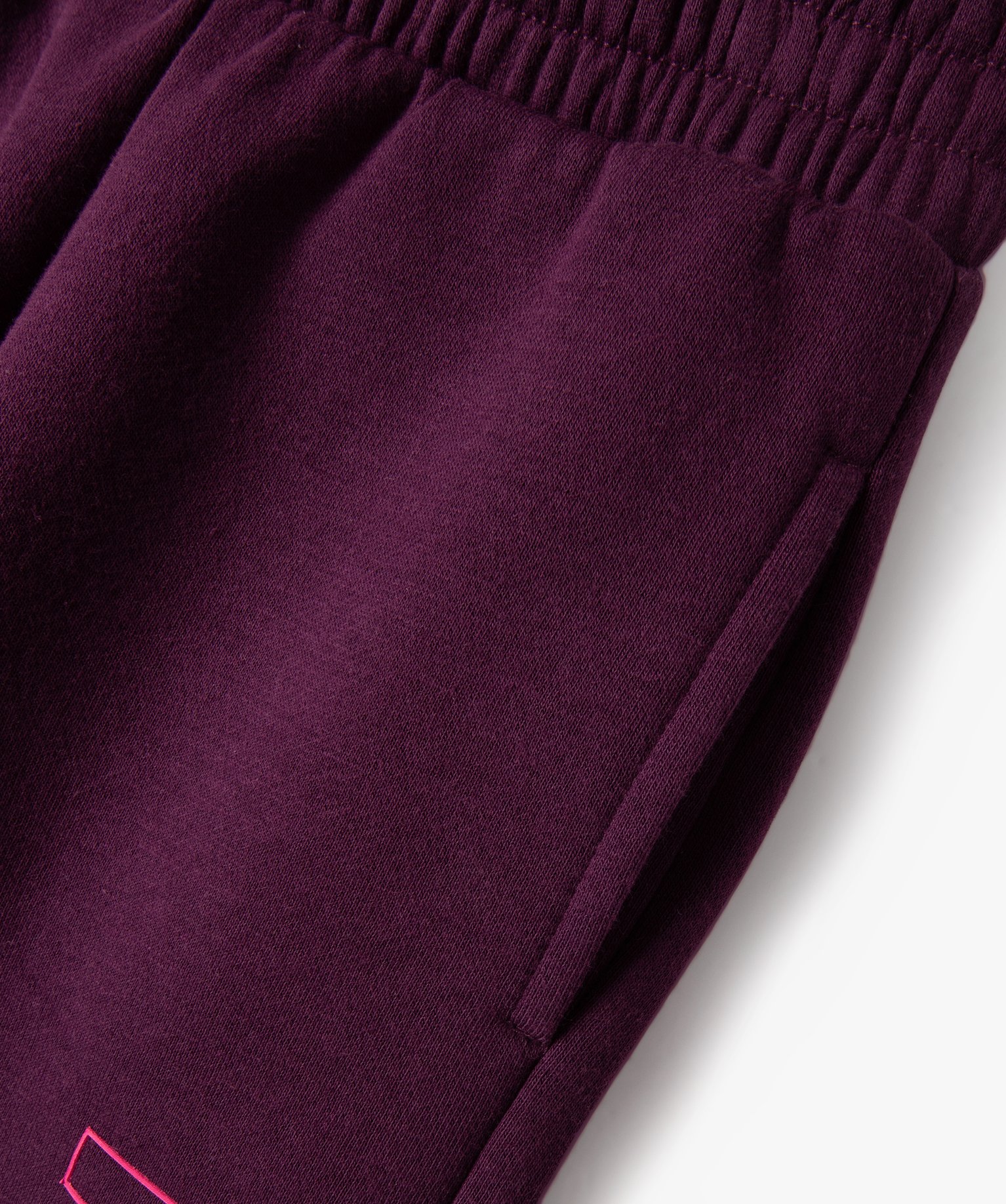 Pantalon de jogging fille avec inscription sur le cté rouge fonce | GEMO