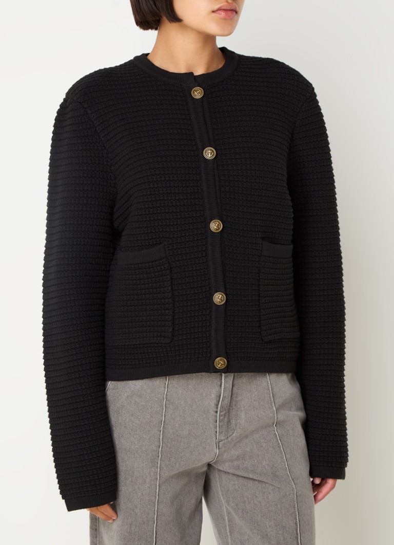 Cardigan gros tricotat de Sofie Schnoor, cu buzunare aplicate.