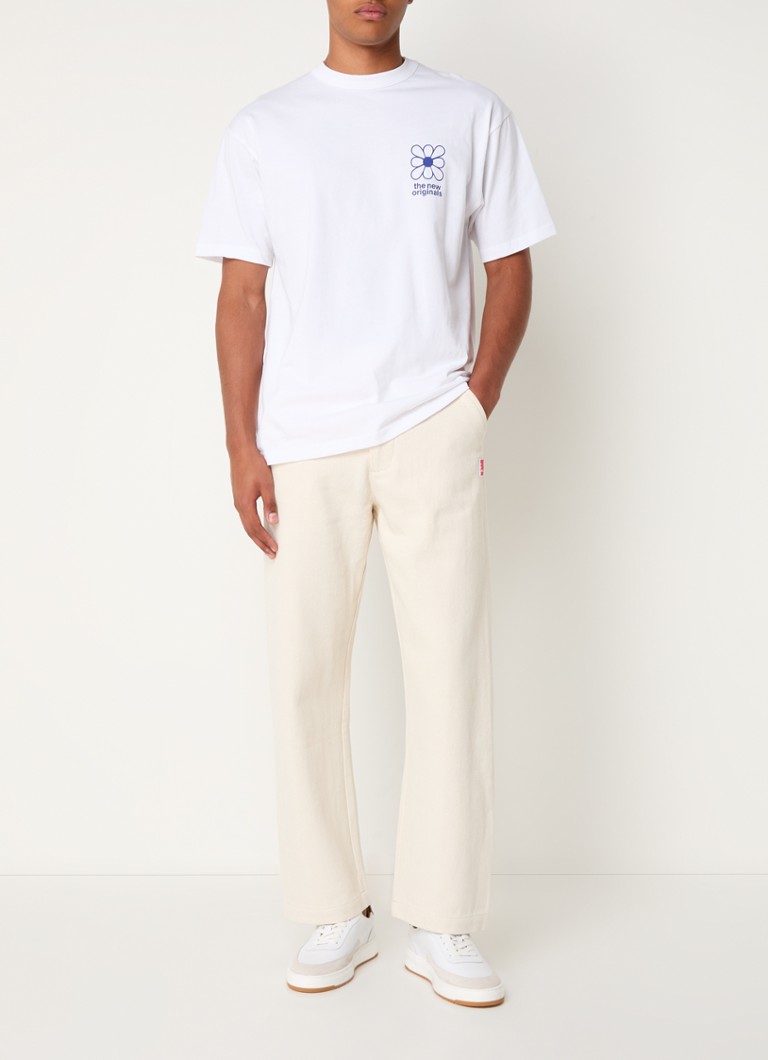Pantaloni New Originals, fără cusături, conici, cu textură și un logo îndrăzneț.