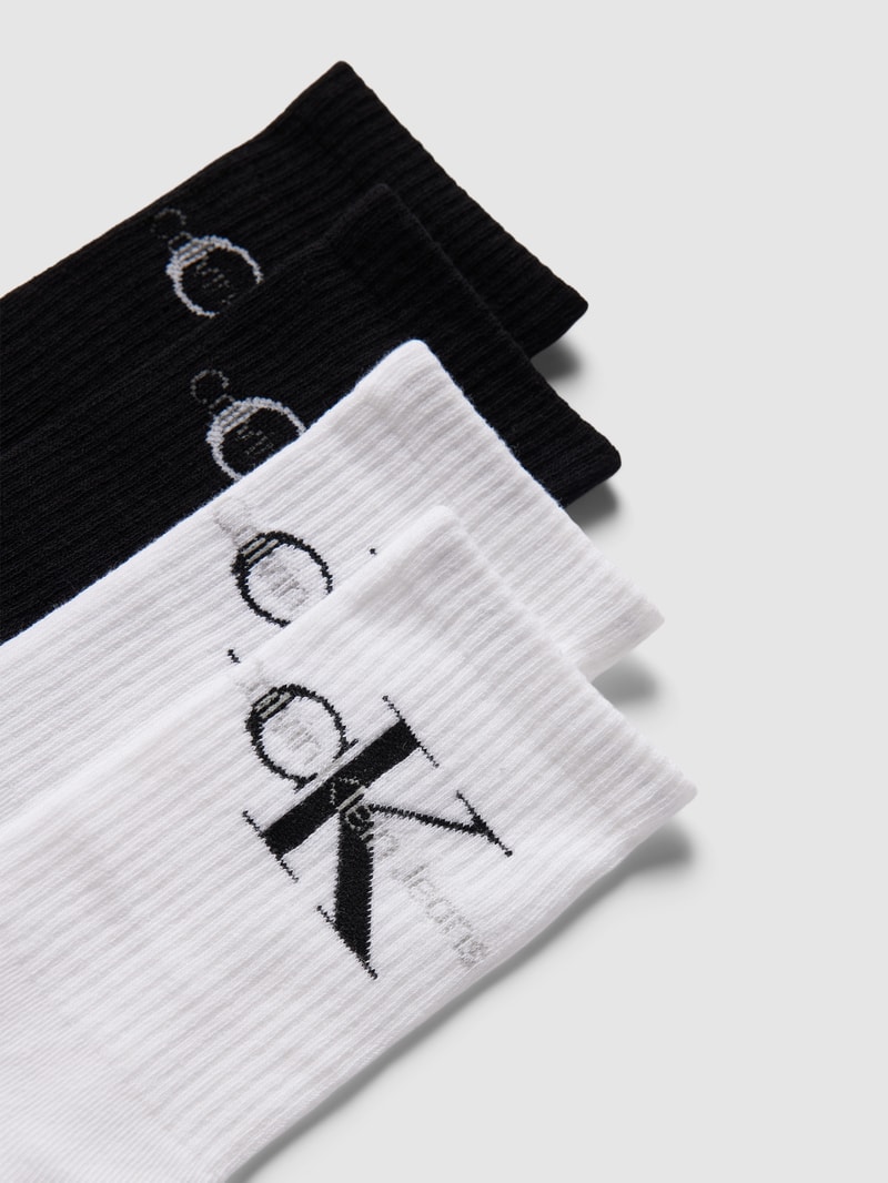Socken mit Label-Print im 4er-Pack in schwarz