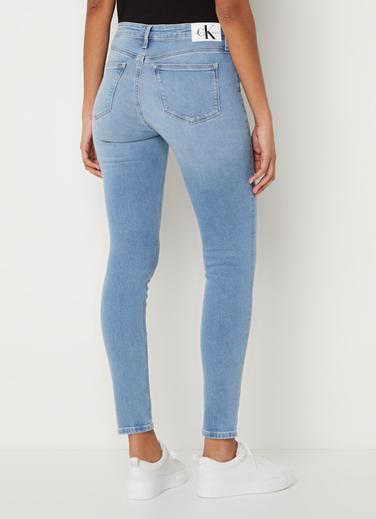 Jeans skinny a vita media Calvin Klein, lavaggio chiaro