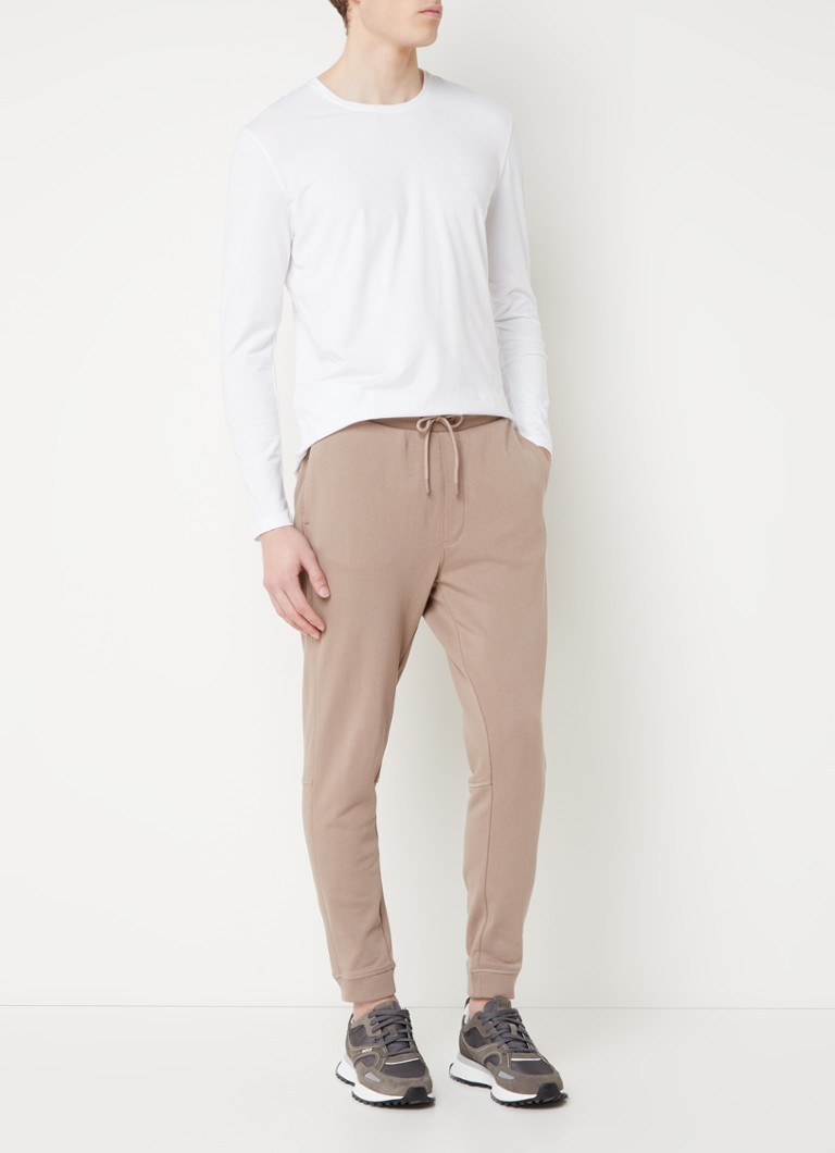 Pantaloni de trening slim fit de la HUGO BOSS, cu logo și buzunare laterale.