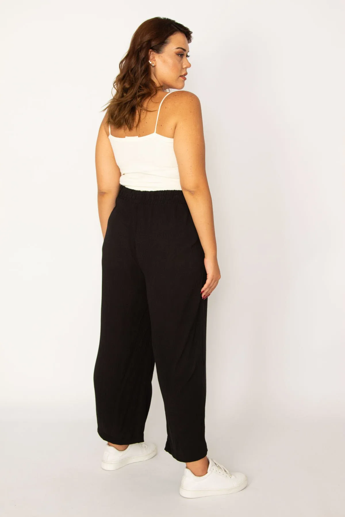 Şans  Damen-Hose aus schwarzem gewebtem Viskose-Stoff in gedrehter Größe mit elastischem Bund und Seitentaschen 65n33982