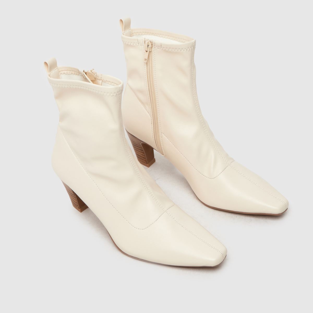 Schuh – Aries – Stretchiga sockstövlar med klack och benvita