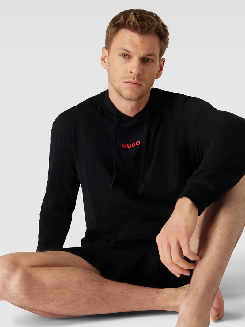 Hoodie in unifarbenem Design mit Känguru-Tasche in schwarz