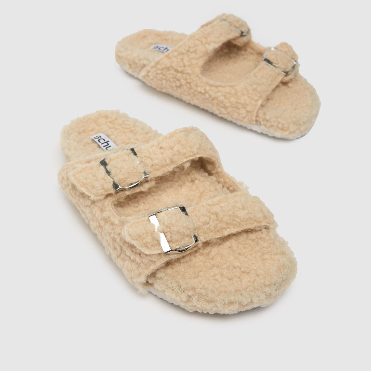 Schuh Haven – Beige tofflor med borgspänne
