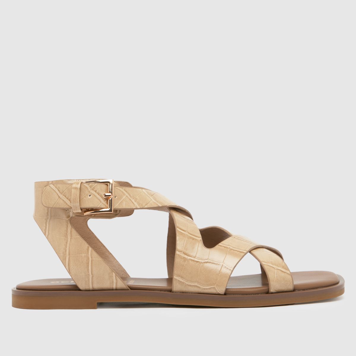 Schuh Tide – Naturfärgade platta sandaler med krokodilmönster