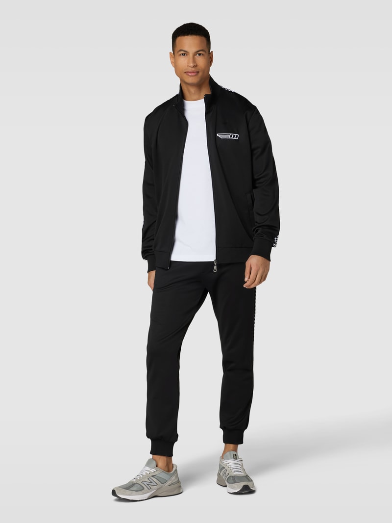 Sweatpants mit Label-Patch in schwarz