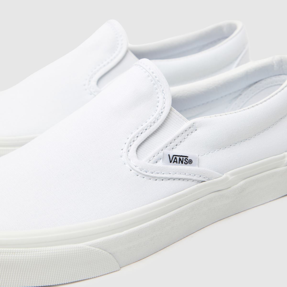 Vans – Vita klassiska slip-sneakers