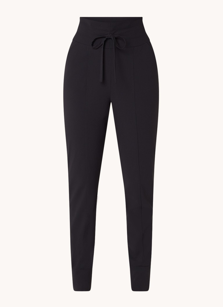 Pantaloni Franka de la Studio Anneloes, cu talie înaltă, croială mulată și buzunare laterale.
