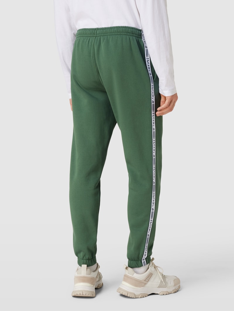 Sweatpants mit Label-Streifen Modell 'TAPE' in grün