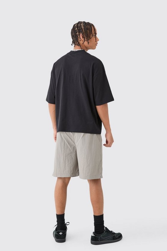 Kastiges Oversize T-Shirt mit Homme Stern Print
