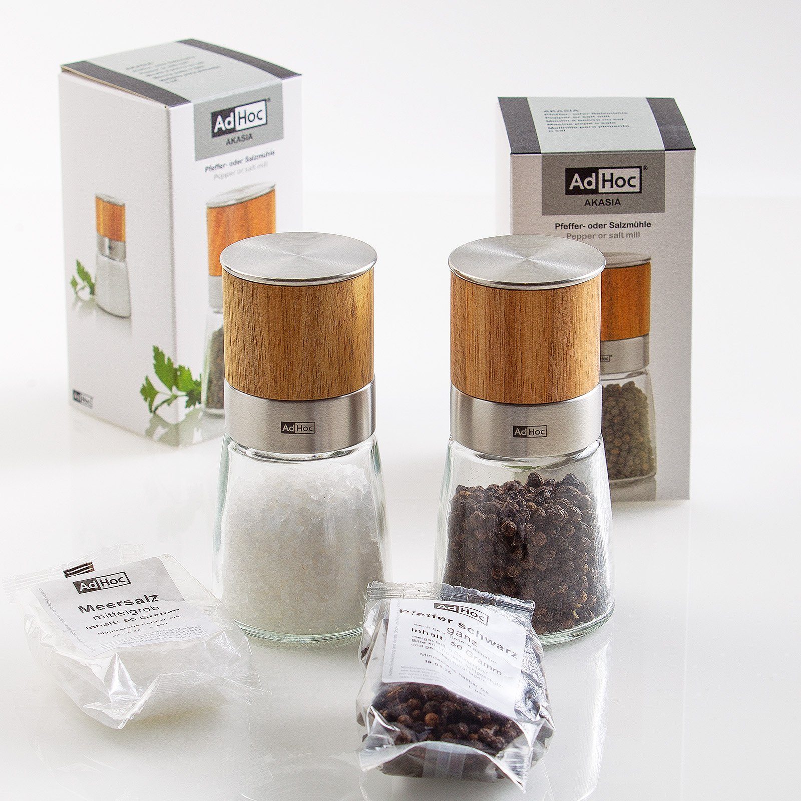 AdHoc Salz-/Pfeffermühle Set aus 2 Gewürzmühlen AKASIA manuell, (2 Stück), edler Glascontainer und Keramik-Mahlwerk, Füllung inklusive