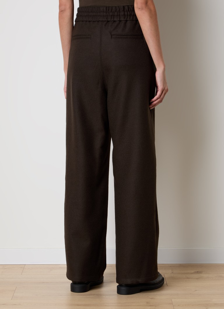 Pantaloni AMI Paris cu talie înaltă și croială largă, confecționați din lână virgină, cu buzunare laterale.