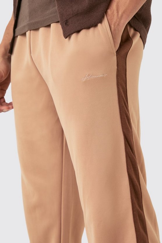 Lockere Trikot-Jogginghose mit Homme-Stickerei