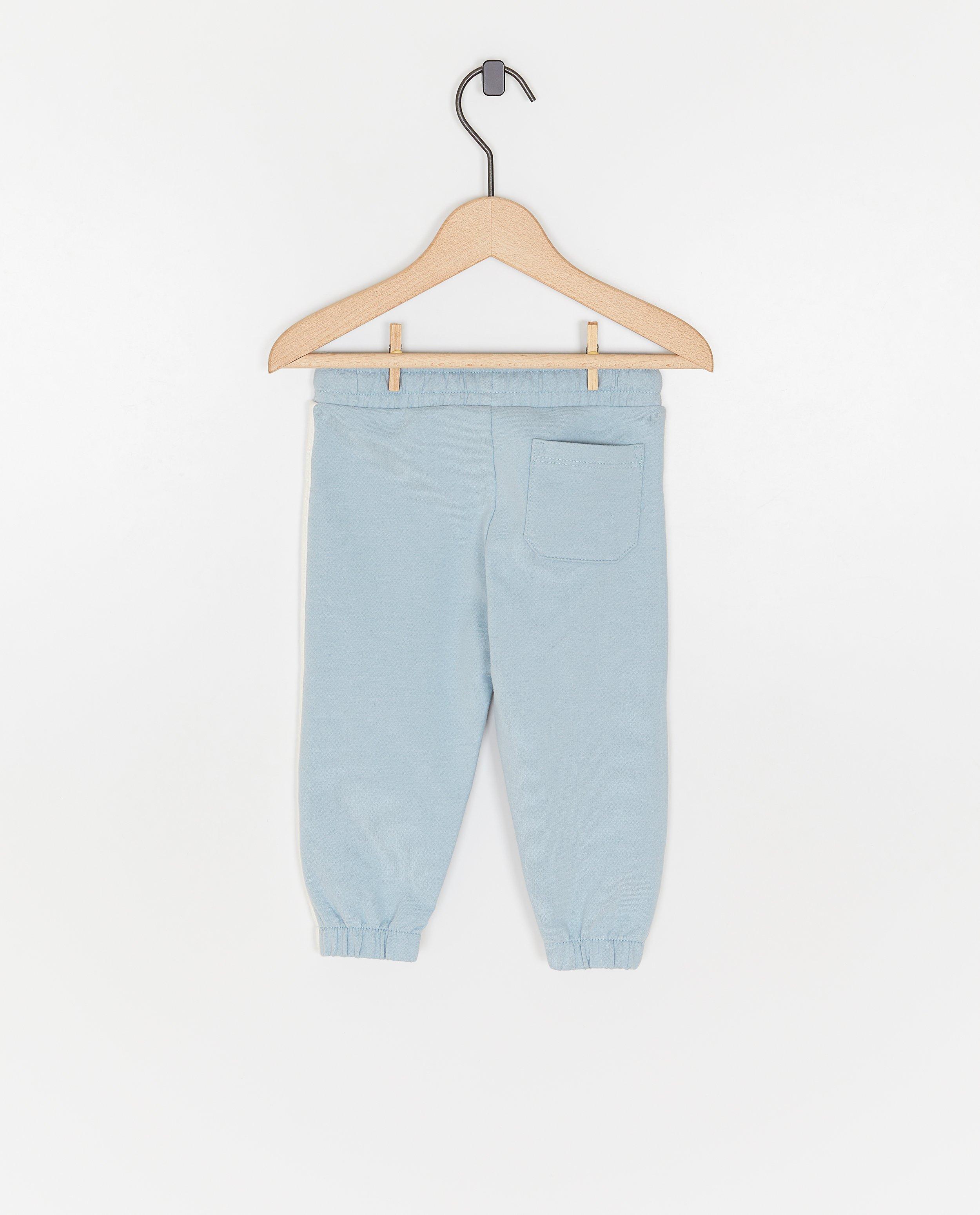 Pantaloni de trening Cuddles and Smiles cu bordură decorativă, unisex albastru deschis