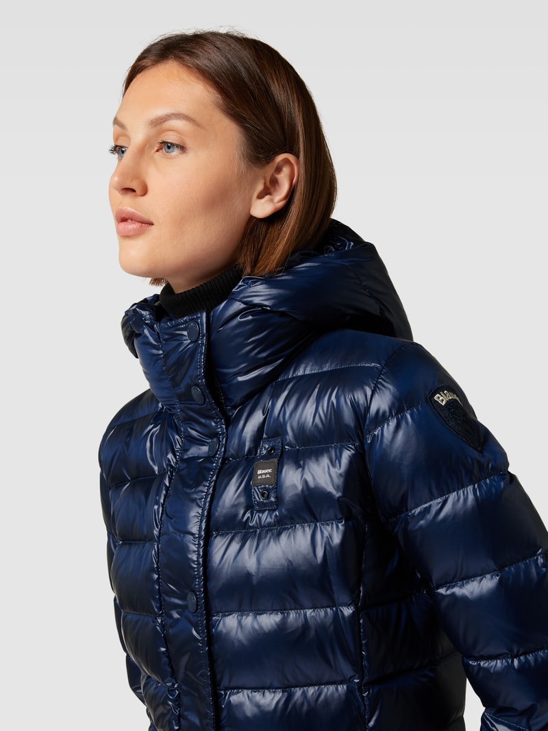 Steppmantel mit Kapuze in marineblau