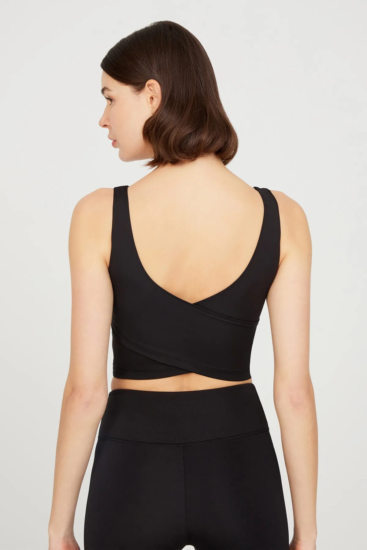 LOS OJOS  Schwarzes, leicht unterstütztes Bustier-Crop-Top mit Ausschnitt am Rücken