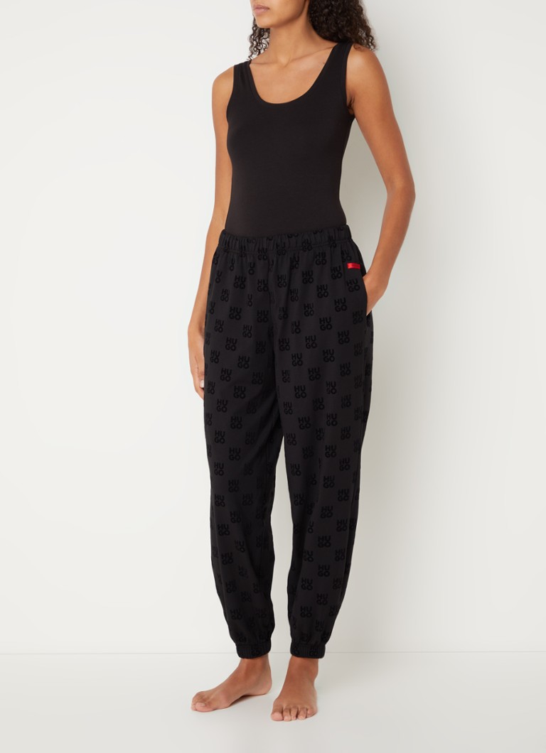 Pantaloni de trening HUGO BOSS cu talie medie și croială slim, confecționați din material plușat și decorați cu un logo imprimat.