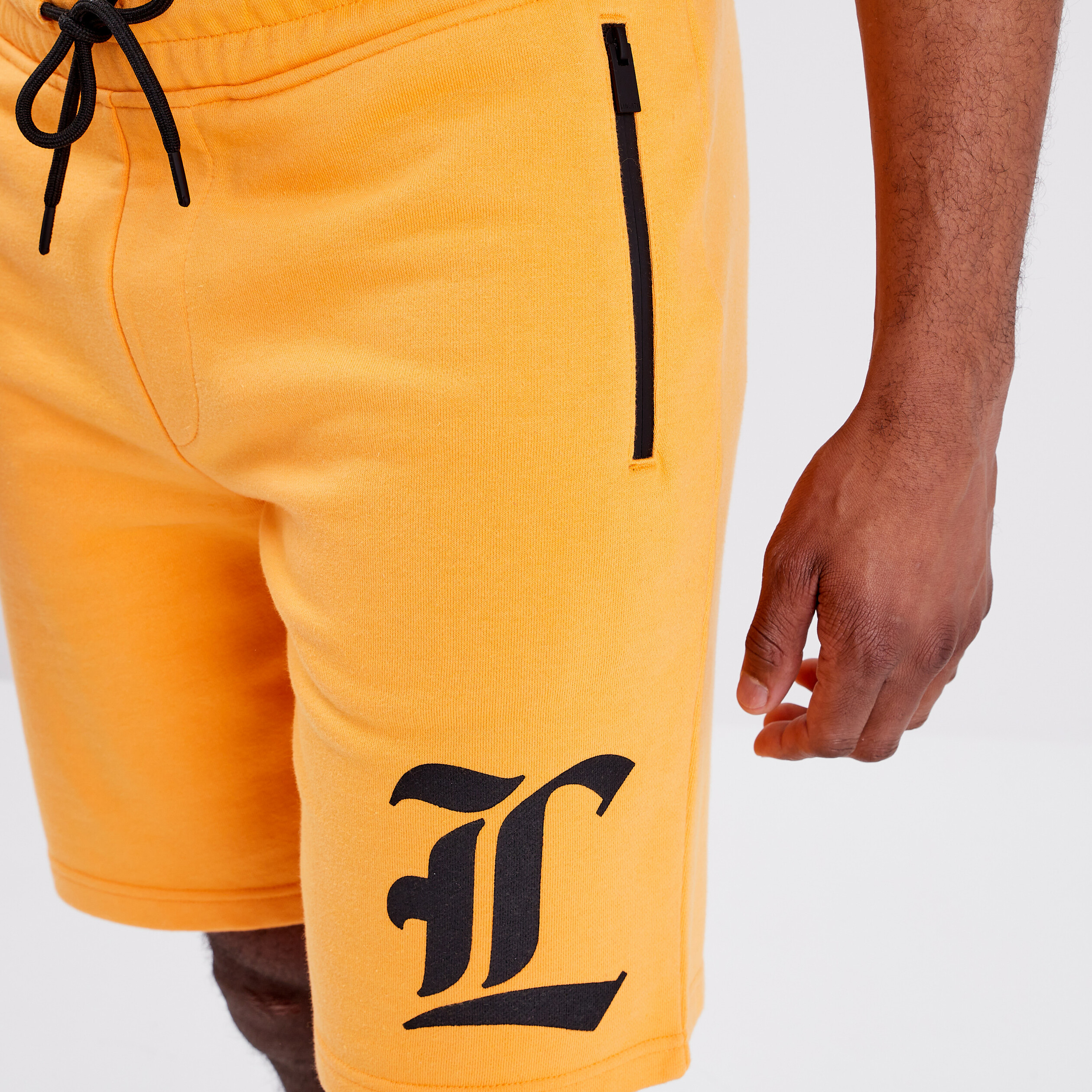 Jogging-Short droit avec poches orange homme | La Halle