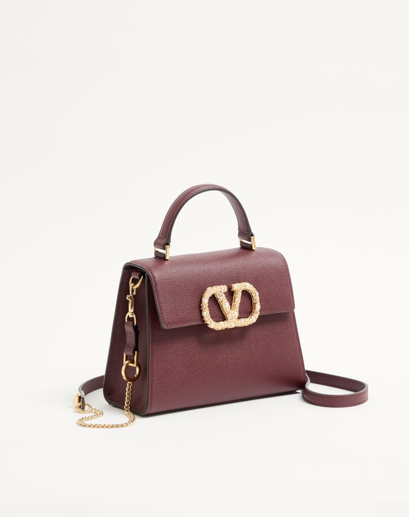 Sac à main Valentino Garavani Vsling petit modèle en cuir de veau grainé avec logo bijou
