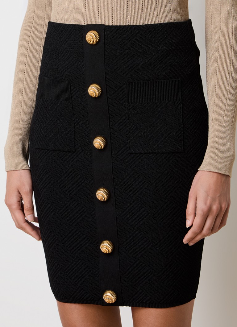 Gonna corta a tubino Balmain in maglia grossa con bottoni decorativi.