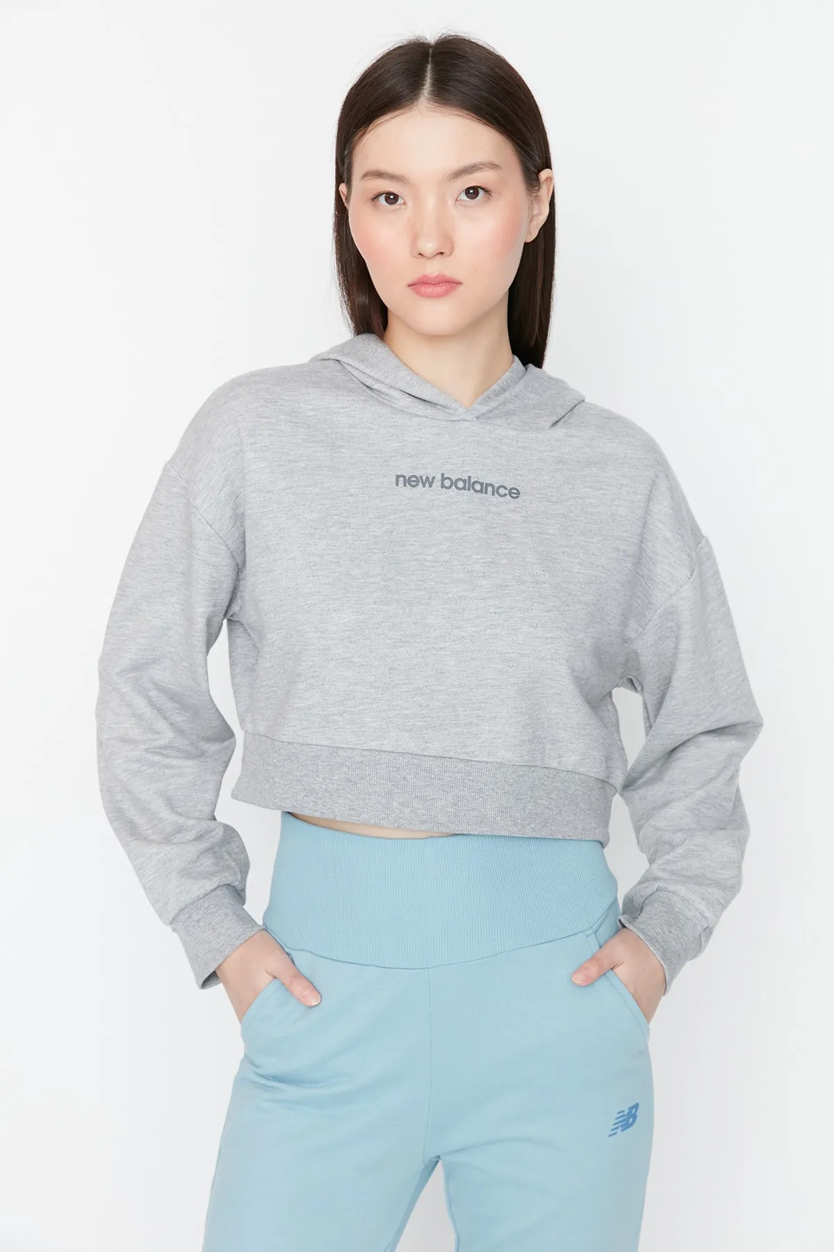 New Balance  Graues Sport-Sweatshirt für Damen WTH053-AG
