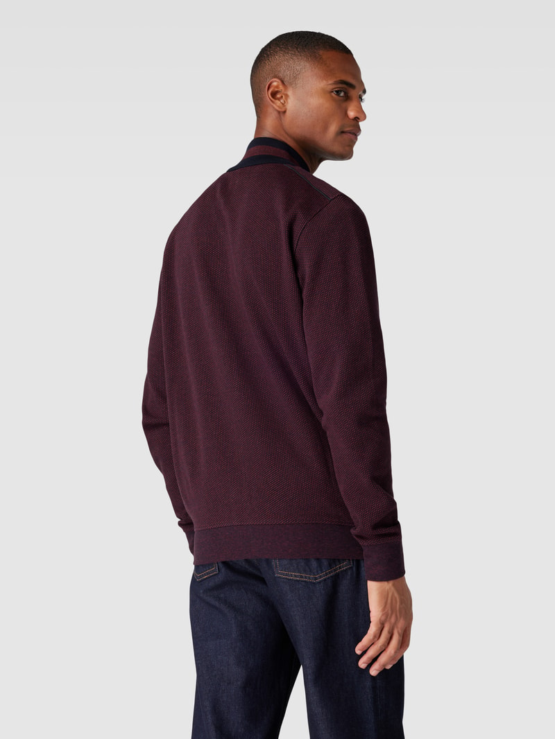 Sweatjacke mit Stehkragen und Reißverschlusstaschen in bordeaux rot
